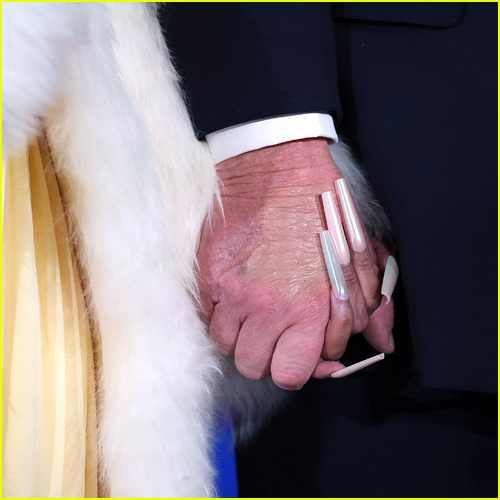 Closeup image of Donald Trump and Nicki Minaj holding hands
