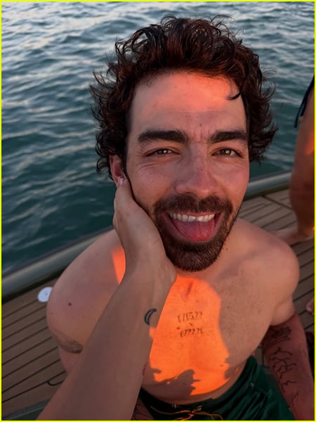 Joe Jonas face caress